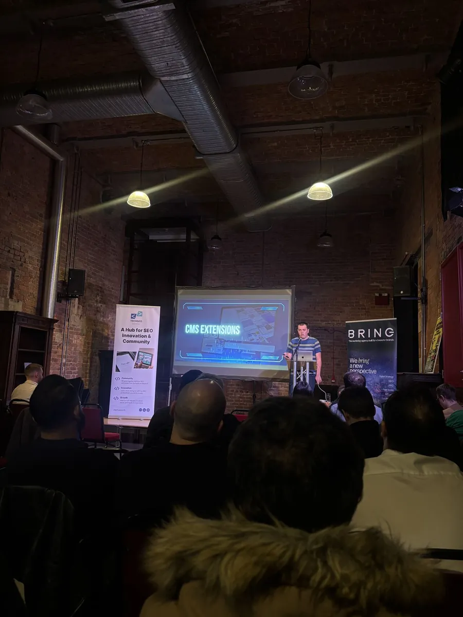 A TSN speaker presenting on CMS extensions to a packed audience