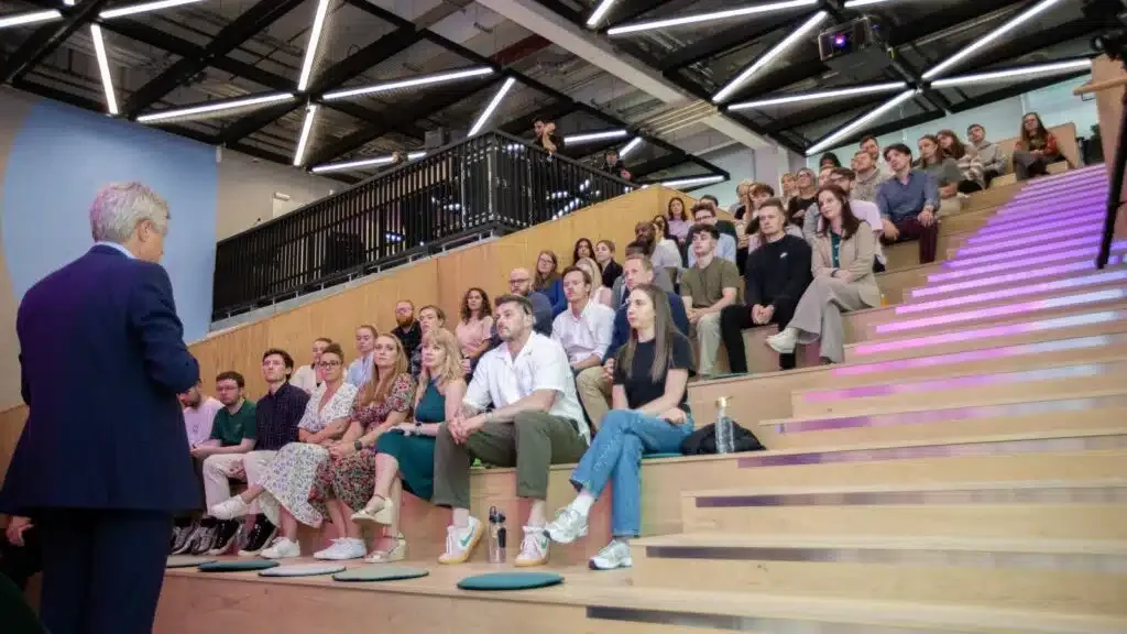 A talk in progress at WPP Campus, tiered seating, full house